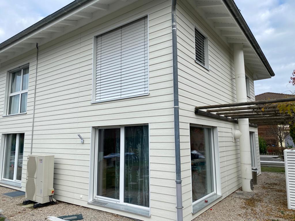 Maison à Rolle avec un bardage en bois